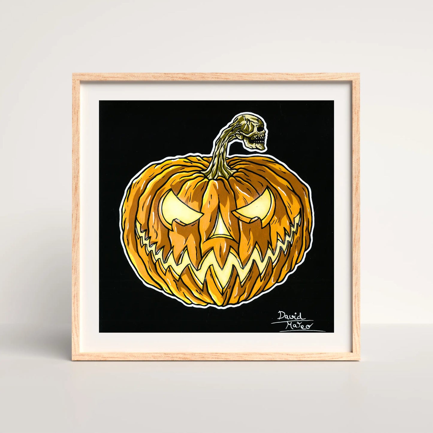 Cuadro moderno enmarcado en madera clara, con una calabaza de Halloween. Es ideal para decoración del hogar festiva de otoño, espacios temáticos o arte que celebra lo macabro.
