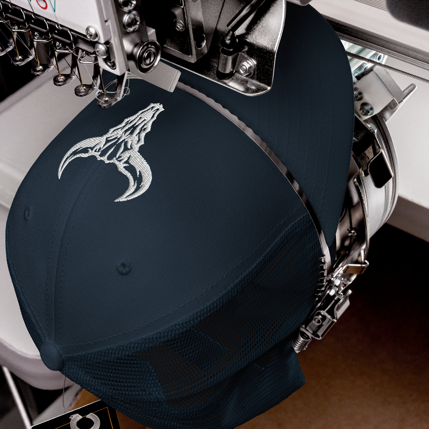 "Emblem" Trucker Cap with Embroidered Logo (Dark Colors)